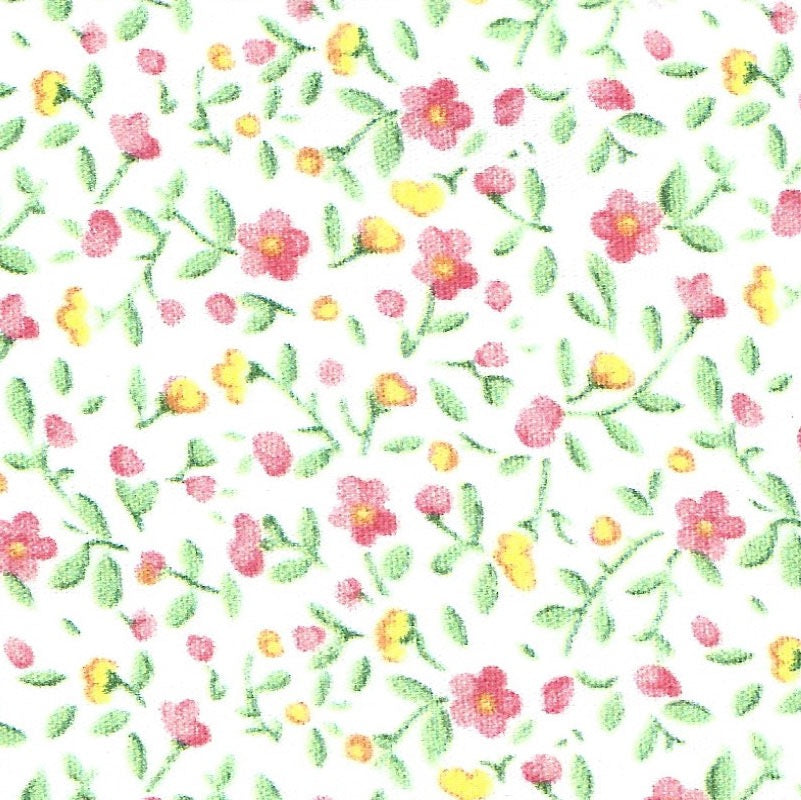 fabric swatch of a pink and green floral print on a solid white background