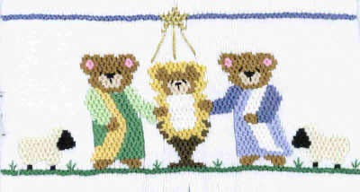 Smocking plate with bears depicting the birth of baby Jesus. 10 1/4 rows of smocking on a yoke.