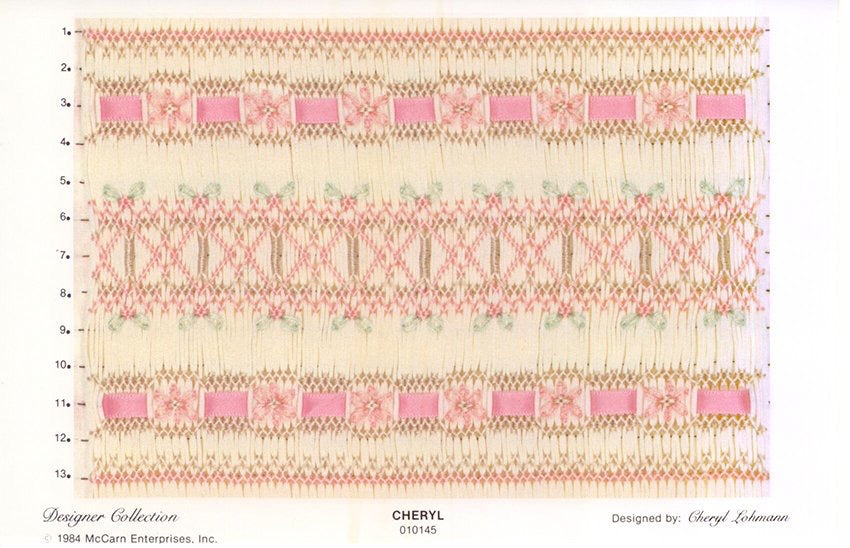 Smocking plate with a geometric design with ribbon and flowers smocked in ecru and pink on ivory pleated fabric 13 rows of smocking.