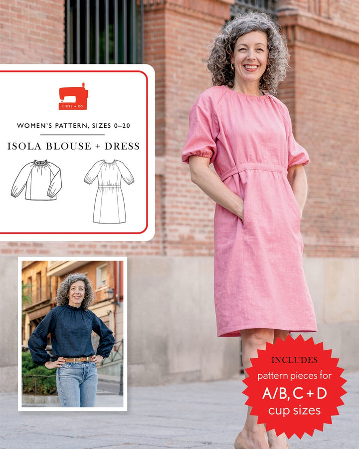 Woman wearing a pink dress with sewing pattern packaging in the background