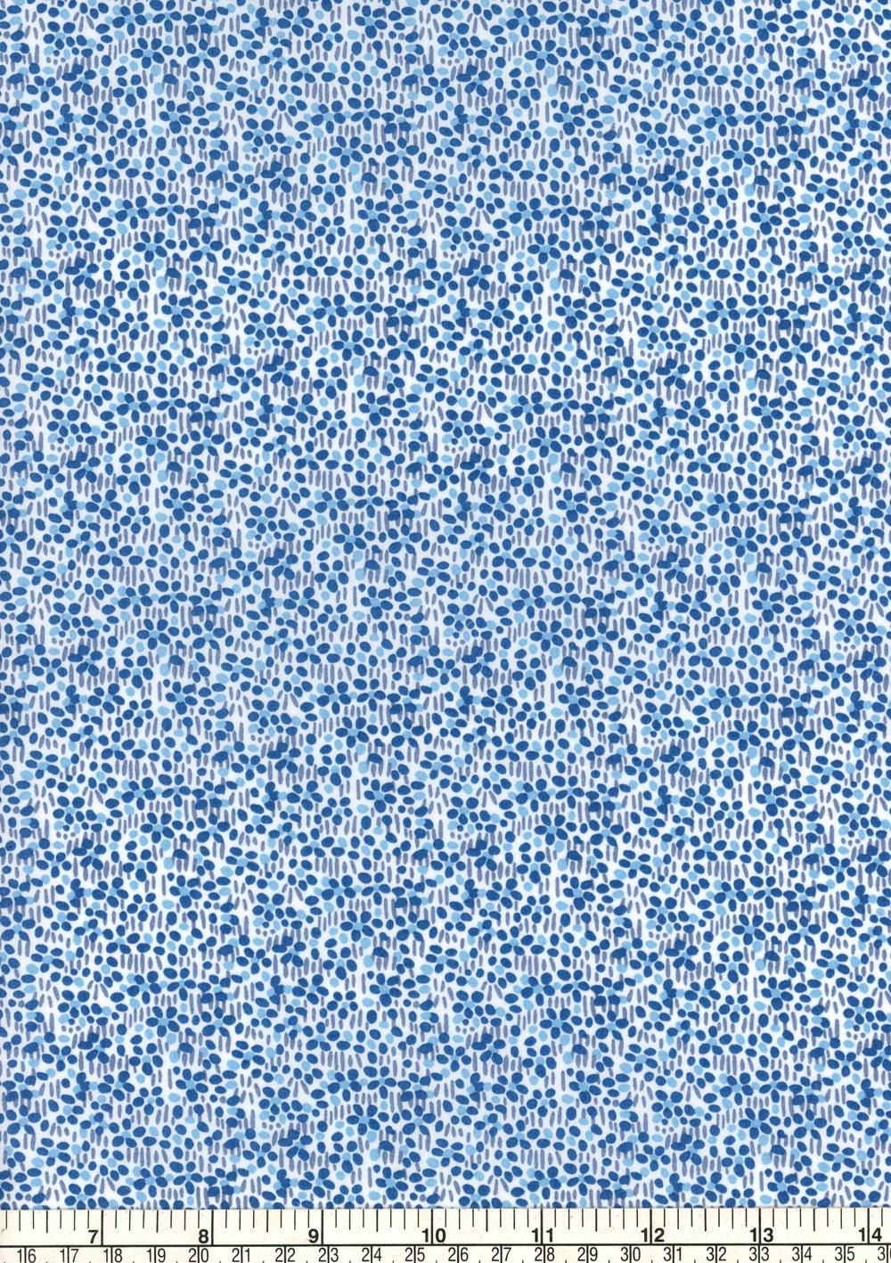 Blue and white floral pattern fabric with a ruler at the bottom