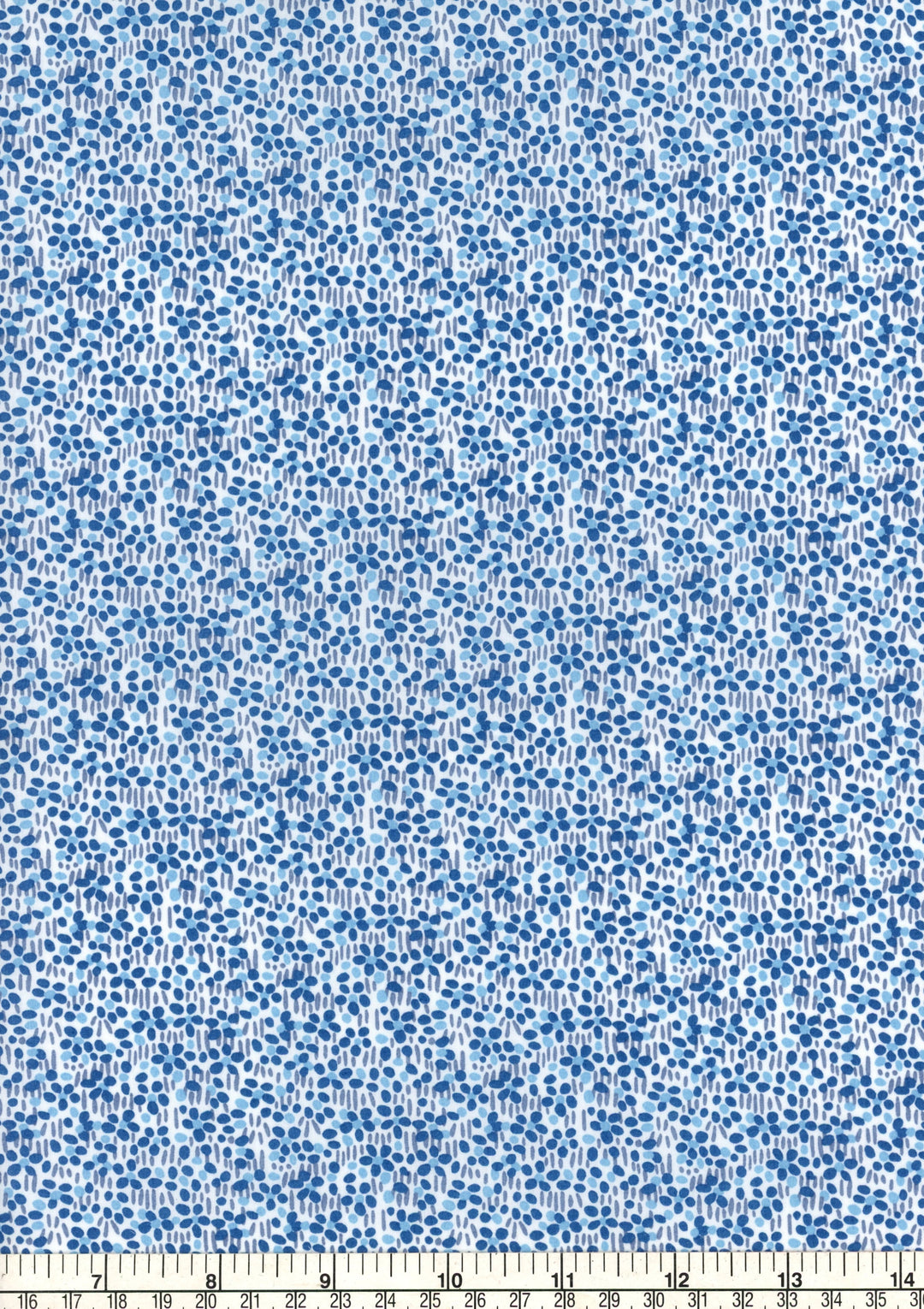 Blue and white floral pattern fabric with a ruler at the bottom