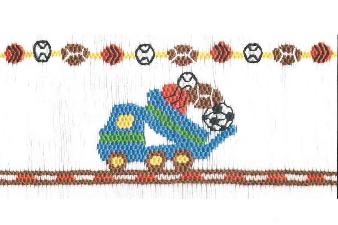 Smocking plate featuring a blue dump truck carrying soccer balls, with a horizontal border of sports balls (baseballs, footballs, basketballs) above and below on a white background.