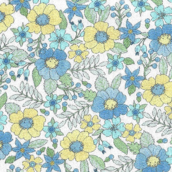 Pattern of blue and yellow flowers on a white background
