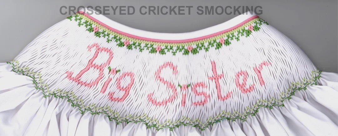 Smocking plate with Big Sister in smocked lettering. 