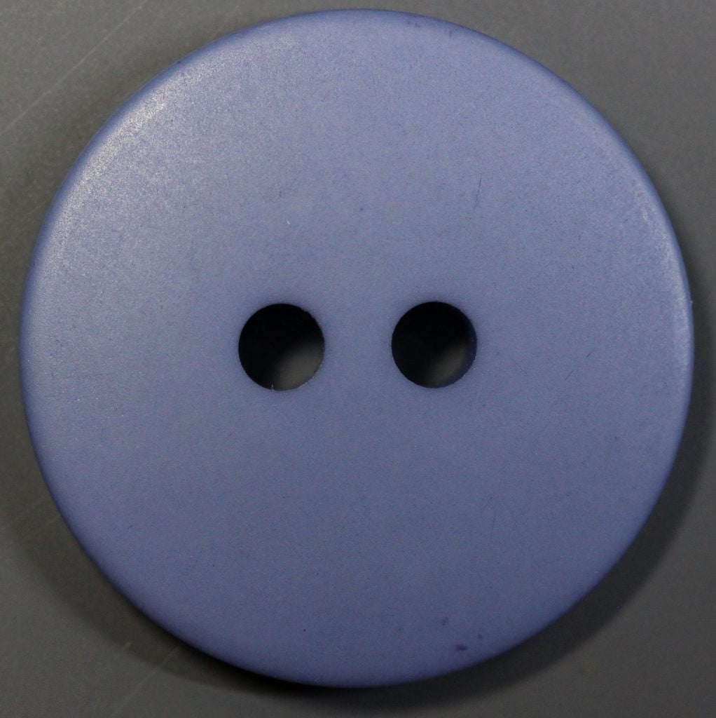 Blue button with two holes on a gray background