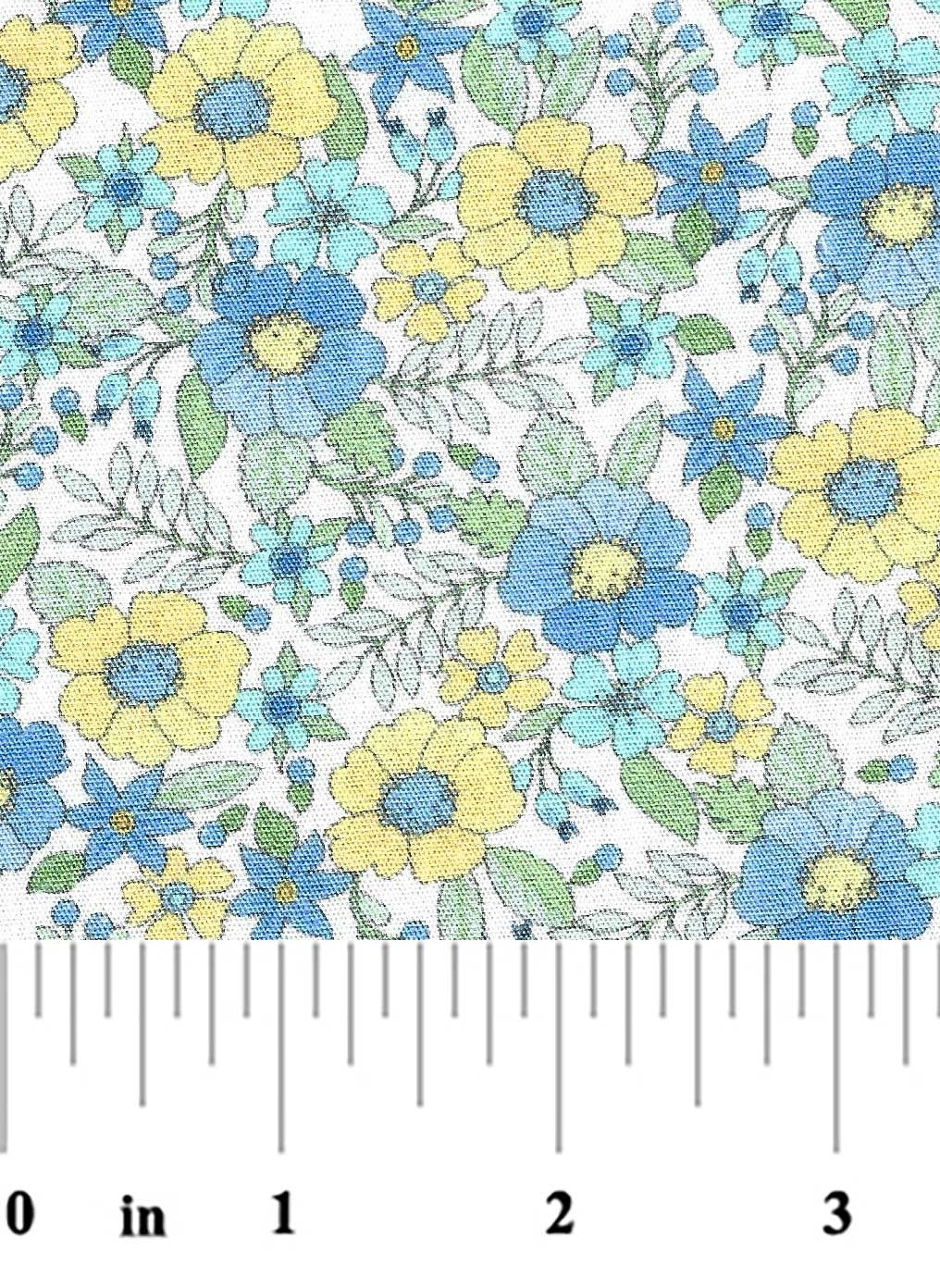 Floral pattern with blue and yellow flowers on a white background, measured by a ruler.