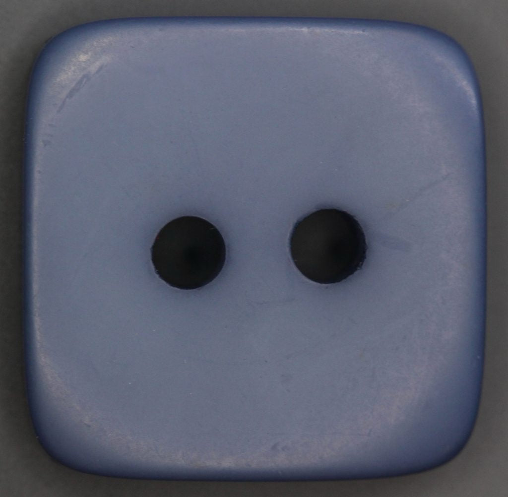Blue square button with two holes on a dark gray background