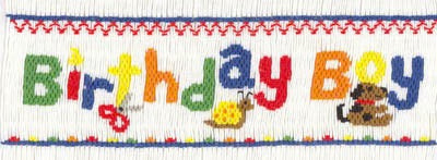 Smocking plate with the words "birthday boy". 8 rows of smocking on a yoke.