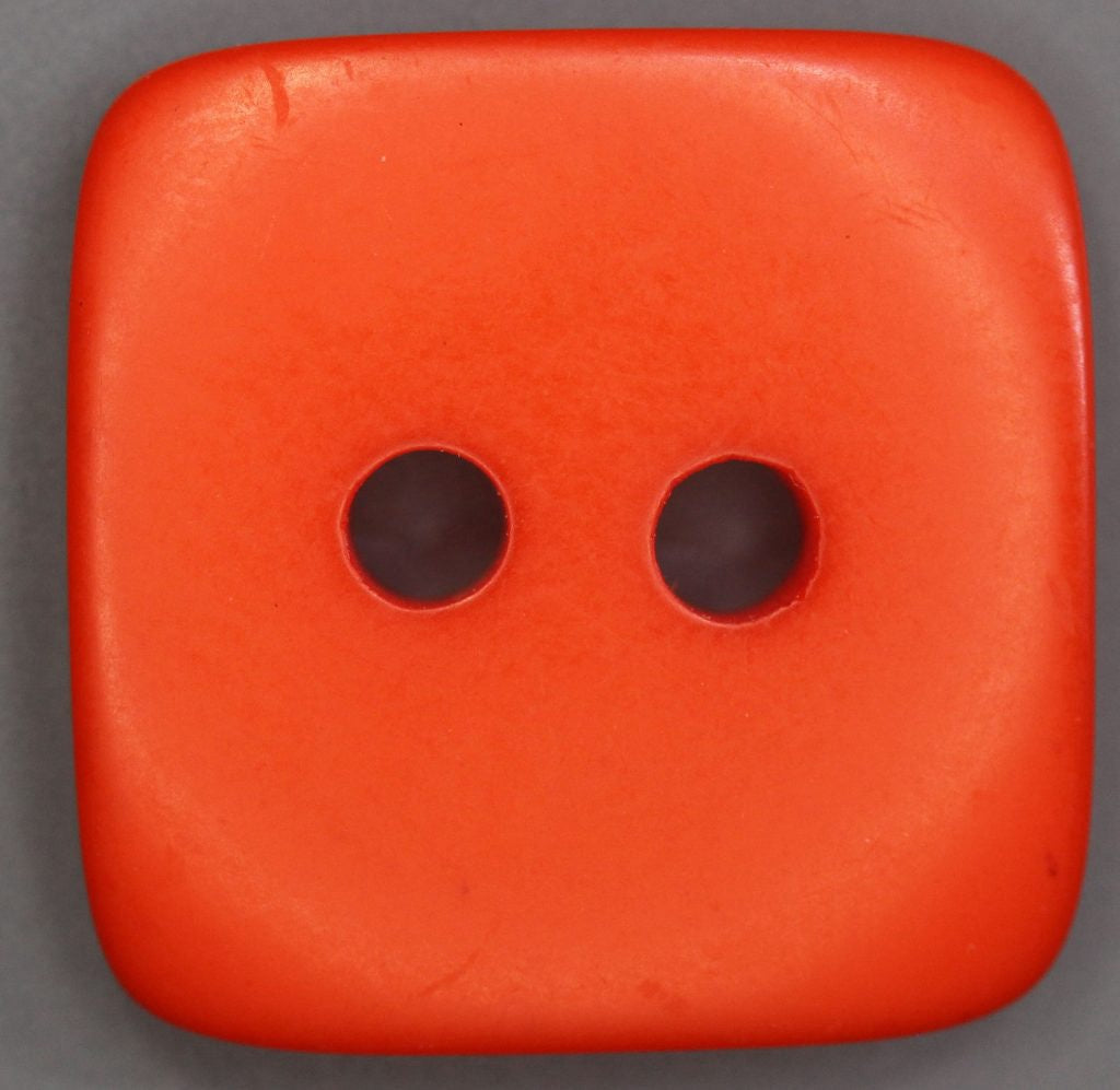 Dark orange 2 hole  square button on a dark background.