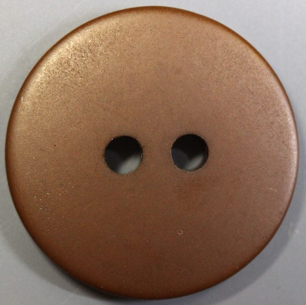 Bronze-colored button with two holes on a white background