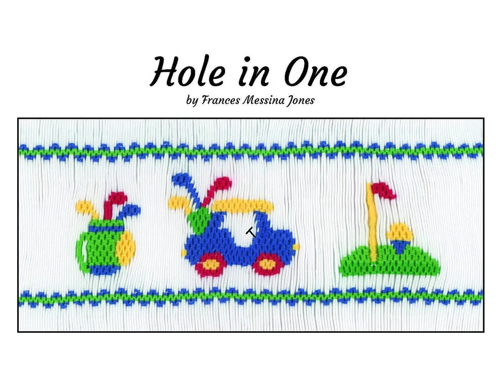 A smocking plate titled 'Hole in One' by Frances Messina Jones, showing a smocked insert with golf-themed motifs including a green hole, a blue golf cart, and a golf bag on a white fabric background.