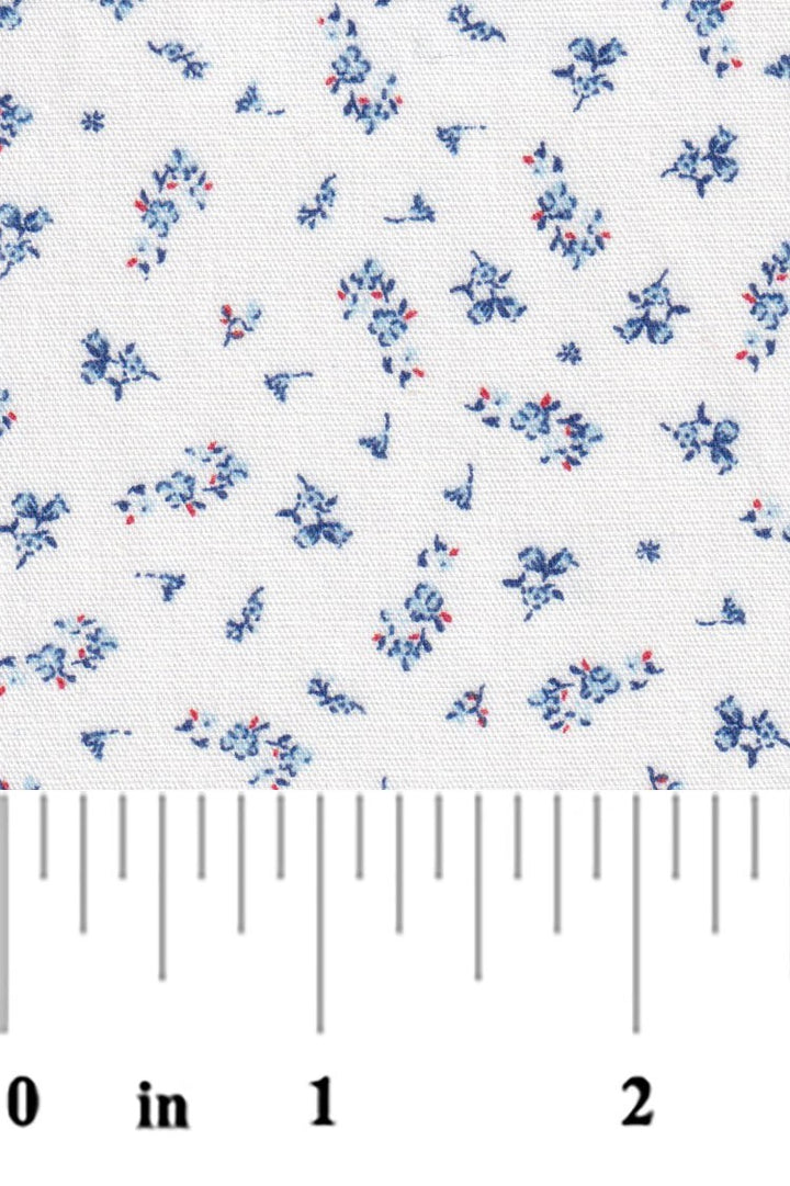 Floral patterned fabric with a ruler at the bottom for scale on a white background