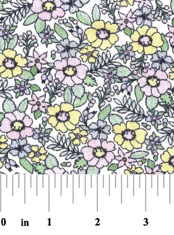 Floral patterned fabric with a ruler at the bottom for scale