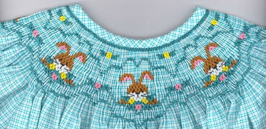 Smocking plate with bunnies and eggs. 7 rows of smocking on a bishop.