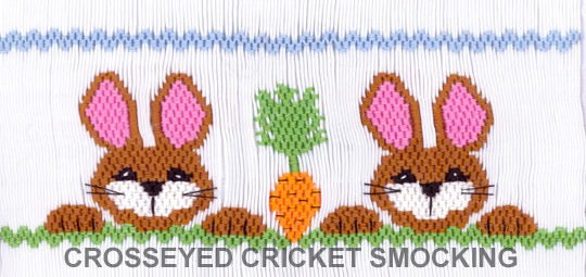 Smocking plate two bunnies showing off their carrot. 8 1/2 rows of smocking on a yoke.
