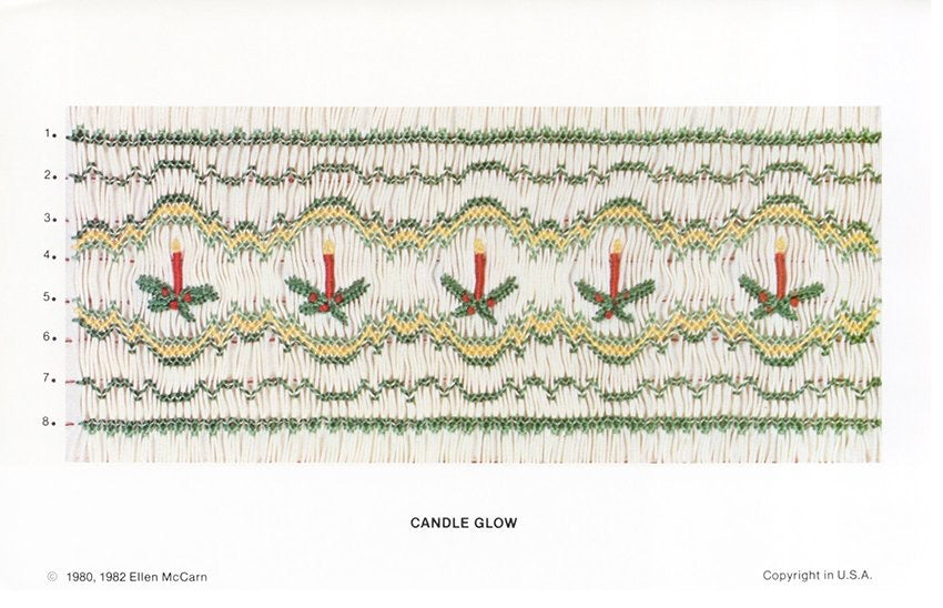 Smocking plate with a geometric design in greens and gold with red advent candles. 8 rows of smocking on white pleated fabric.