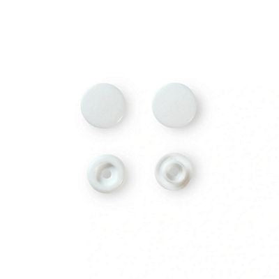 Four white snaps on a white background