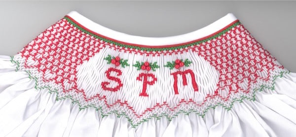 Smocking plate geometric pattern featuring letters for a monogram and holly berries. Includes all letters but no numbers. 8 rows of smocking on a bishop.