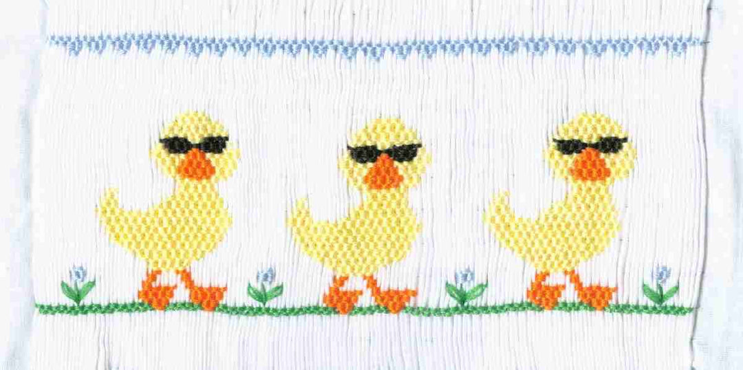Smocking plate with three ducks with sunglasses. 9 rows of smocking on a yoke.