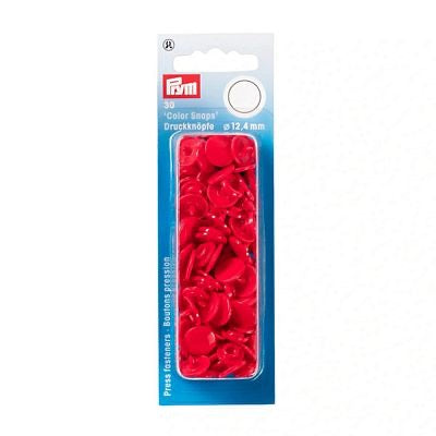 A package of red plastic button snaps in a blue and white retail card, with the brand 'Rim' visible at the top.