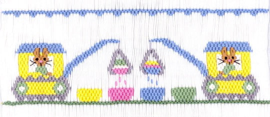 Smocking plate with bunnies in cranes dipping Easter eggs. 8 rows of smocking on a yoke.