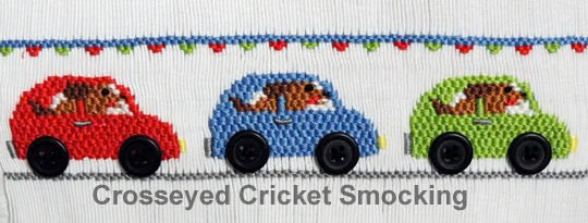 Smocking plate with three cars with dog drivers. 5 1/2 rows of smocking on a yoke.
