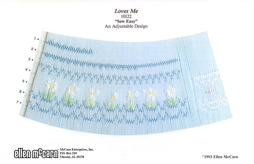 geometric smocking design smocked in blue green pink yellow and white featuring daisies on blue pleated fabric