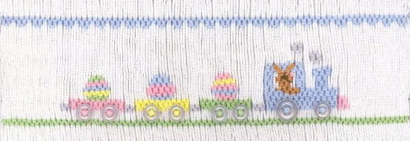 Smocking plate with a bunny driving a train with Easter eggs. 6 rows of smocking on a yoke.