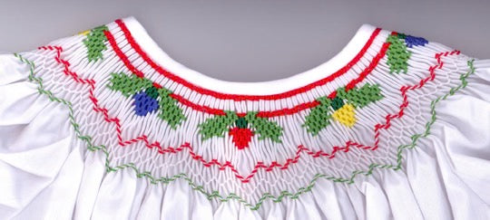 Smocking plate with Christmas lights and holly designed for a bishop. 6 rows of smocking on a bishop.