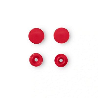 Four small red plastic fasteners or grommet-like hardware pieces arranged in a 2x2 grid on a plain white background.