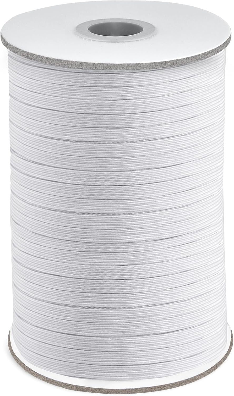 Spool of white thread on a gray background