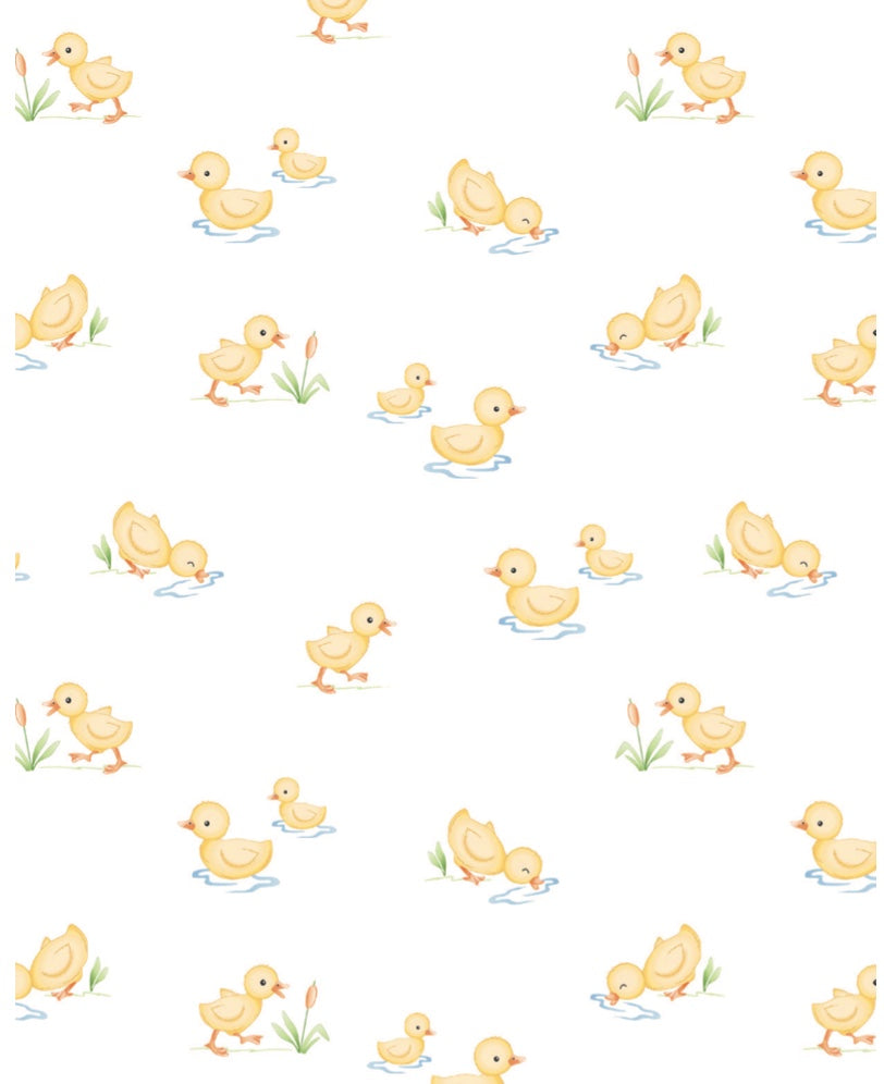 Pattern of yellow ducklings on a white background
