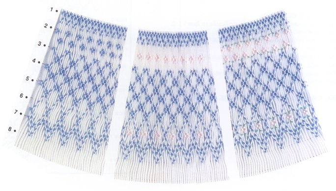 geometric smocking design smocked in blue and pink on white pleated fabric