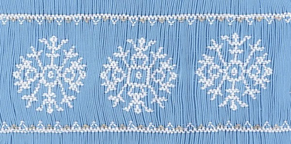 Smocking plate with three snowflakes. 8 3/4 rows of smocking on a yoke.