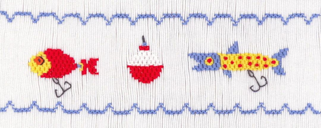 Smocking plate with three different fishing lures. 7 rows of smocking on a yoke.