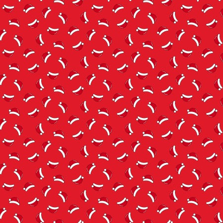 Santa hats scattered on a red background
