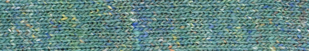 yarn in shades of green with accents of blue 