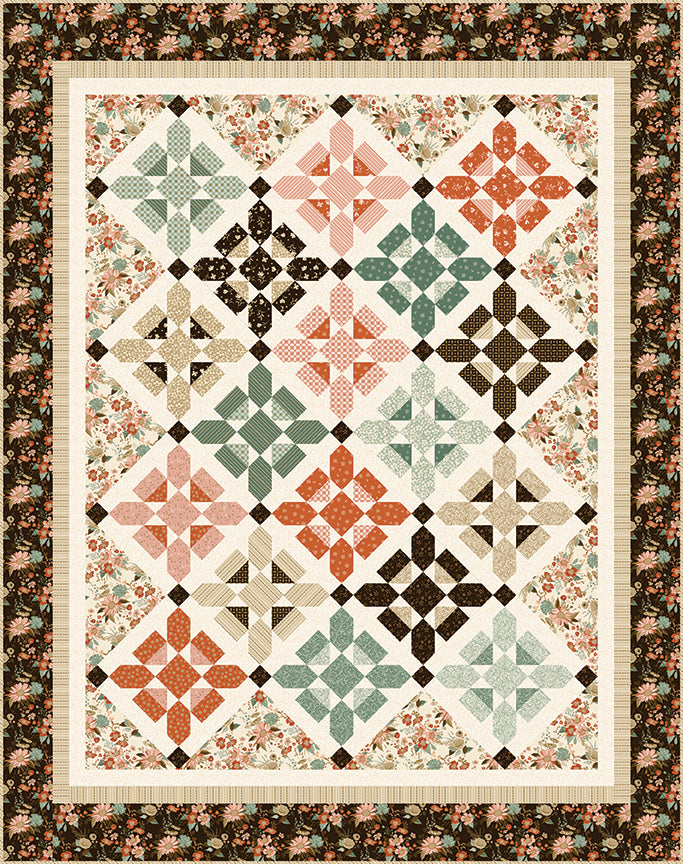 Quilt with geometric pattern and floral border