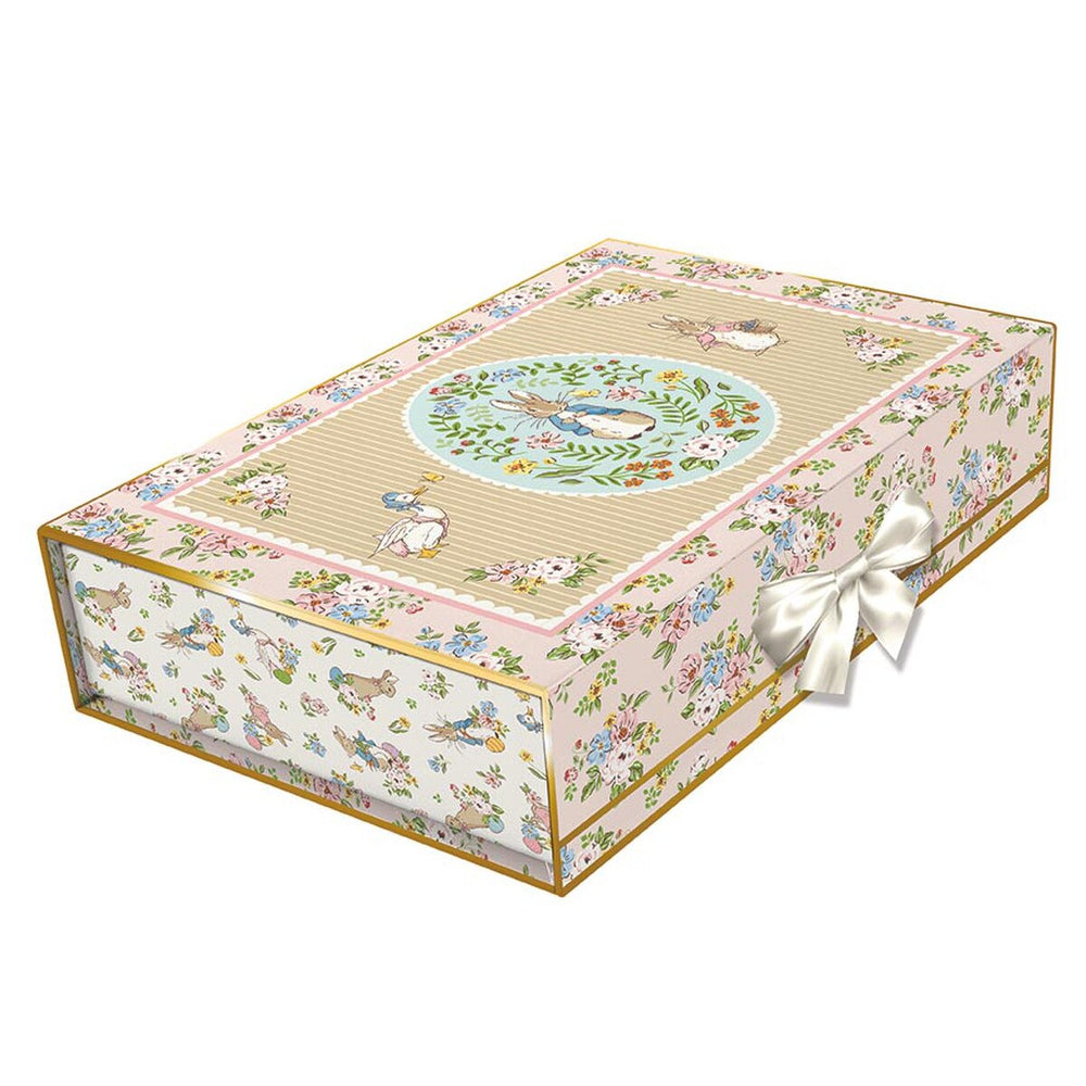 Decorative box with floral patterns and a ribbon on a white background