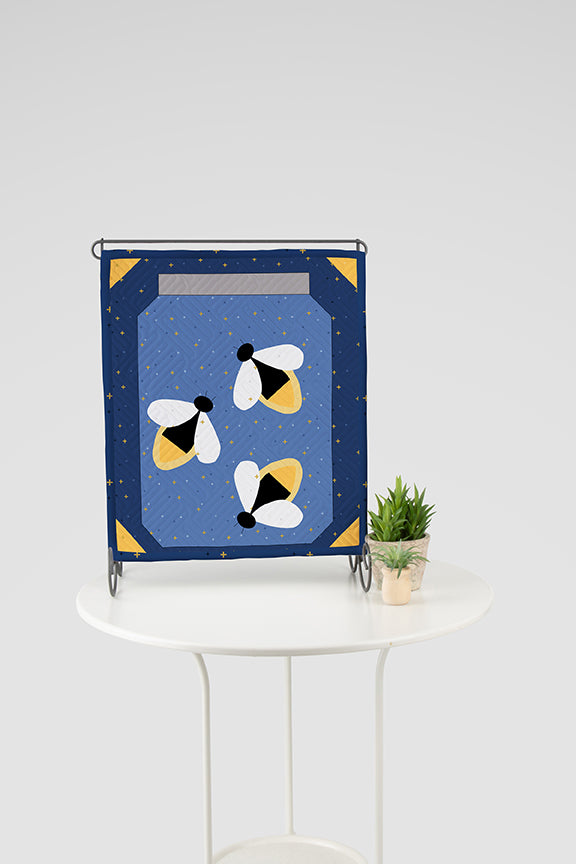 Tabletop banner with a mason jar and lightening bugs