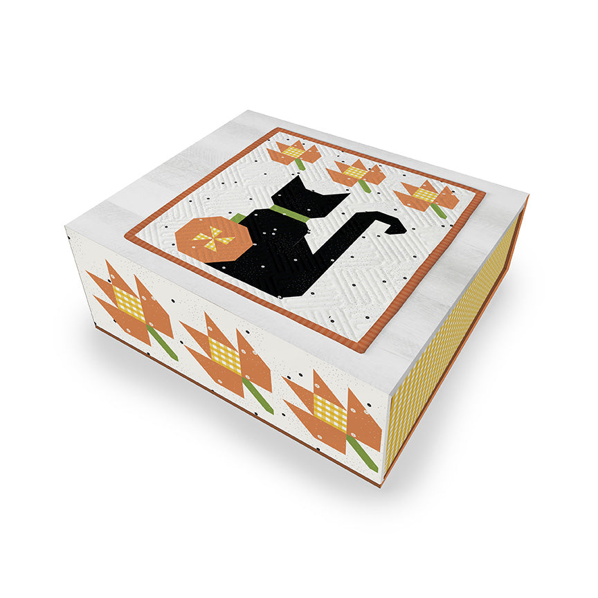 Decorative box with a black cat silhouette and autumn-themed design on a white background