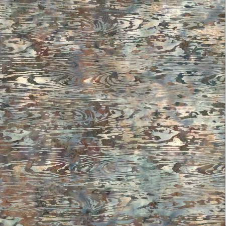 Abstract patterned rug with brown, beige, and gray tones