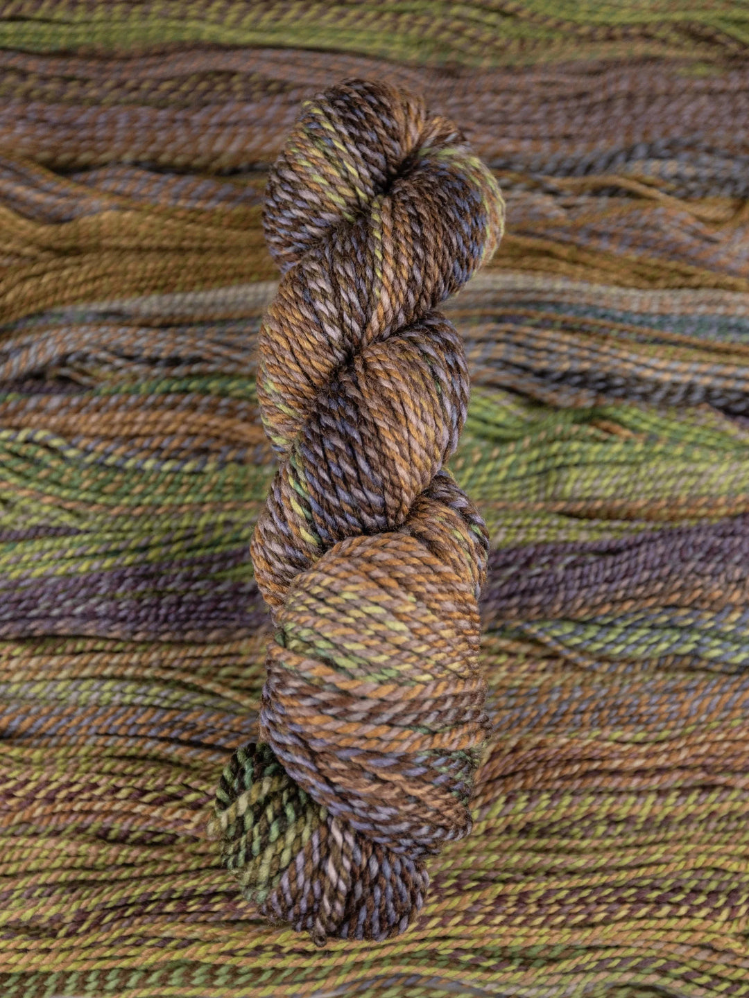 Yarn skein on a textured fabric background