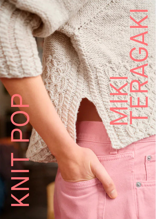 book cover with the torso of a woman wearing an off white split hem cable knit sweater and pink pants with her hand in her back pocket. The title "KNIT POP" in vertical up the left side of the cover in a simple pink font, and the authors name "MIKI TERAGAKI" is in the same orientation and font along the right side