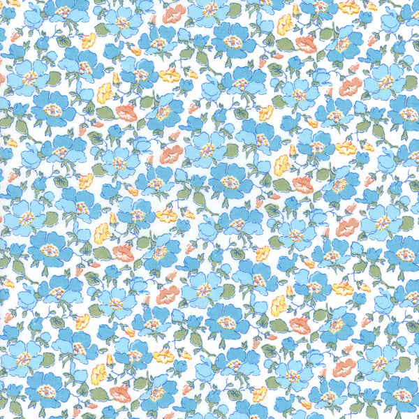 light blue, blue, yellow and orange flowers with green leaves on a white background fabric