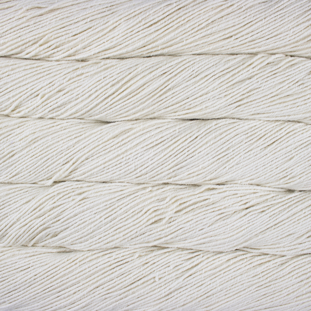 Close-up of white yarn with a textured pattern