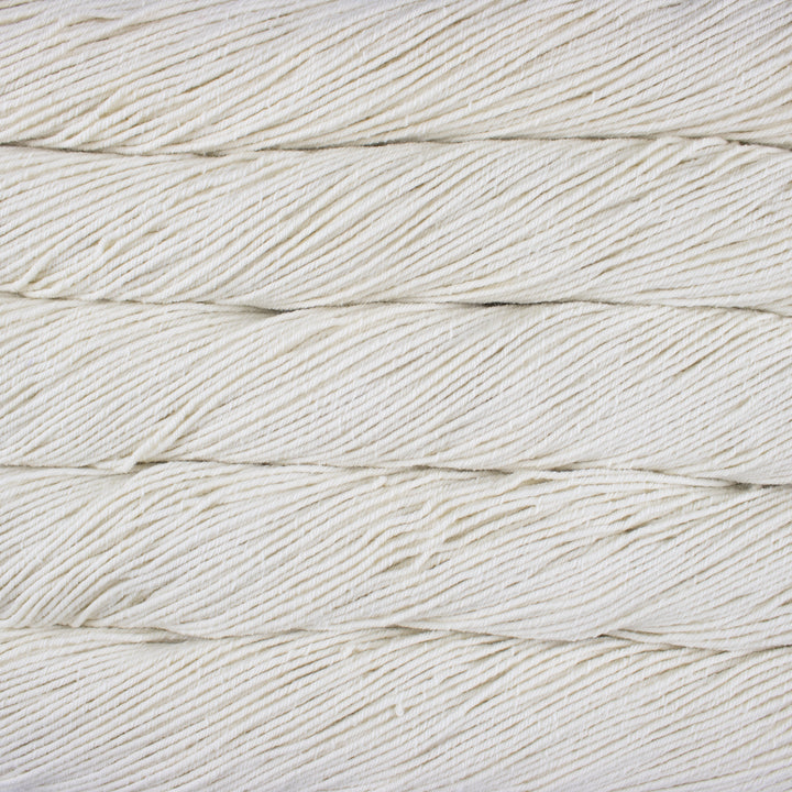 Close-up of white yarn with a textured pattern
