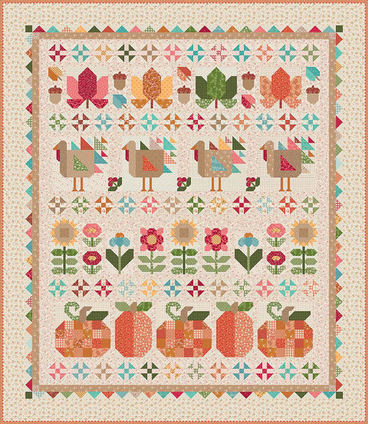 Colorful quilt with geometric patterns of birds, flowers, and pumpkins on a beige background.
