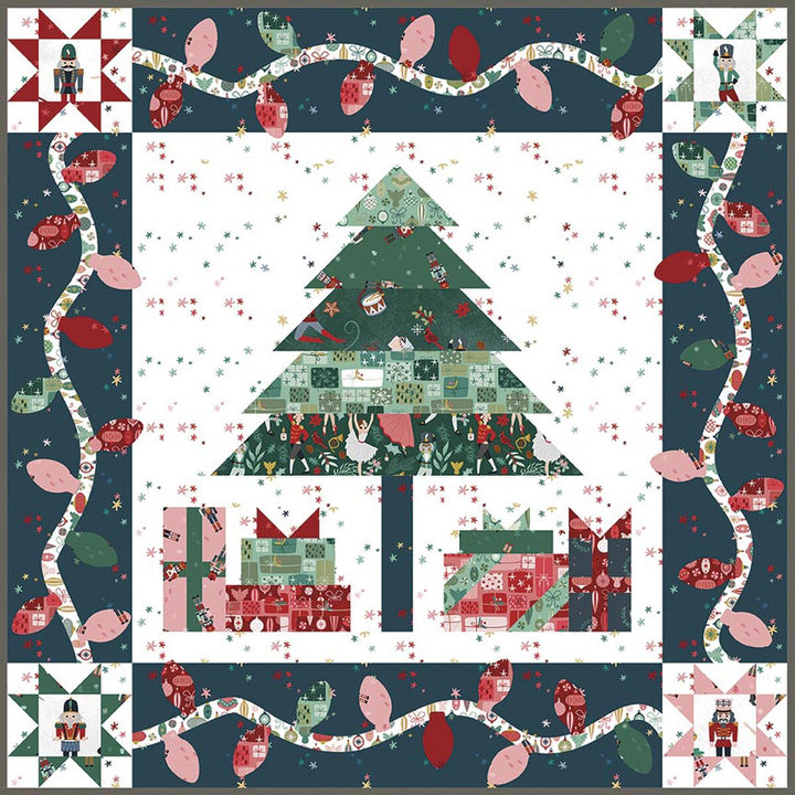 Christmas-themed quilt with a tree, presents, and decorative lights on a blue background.